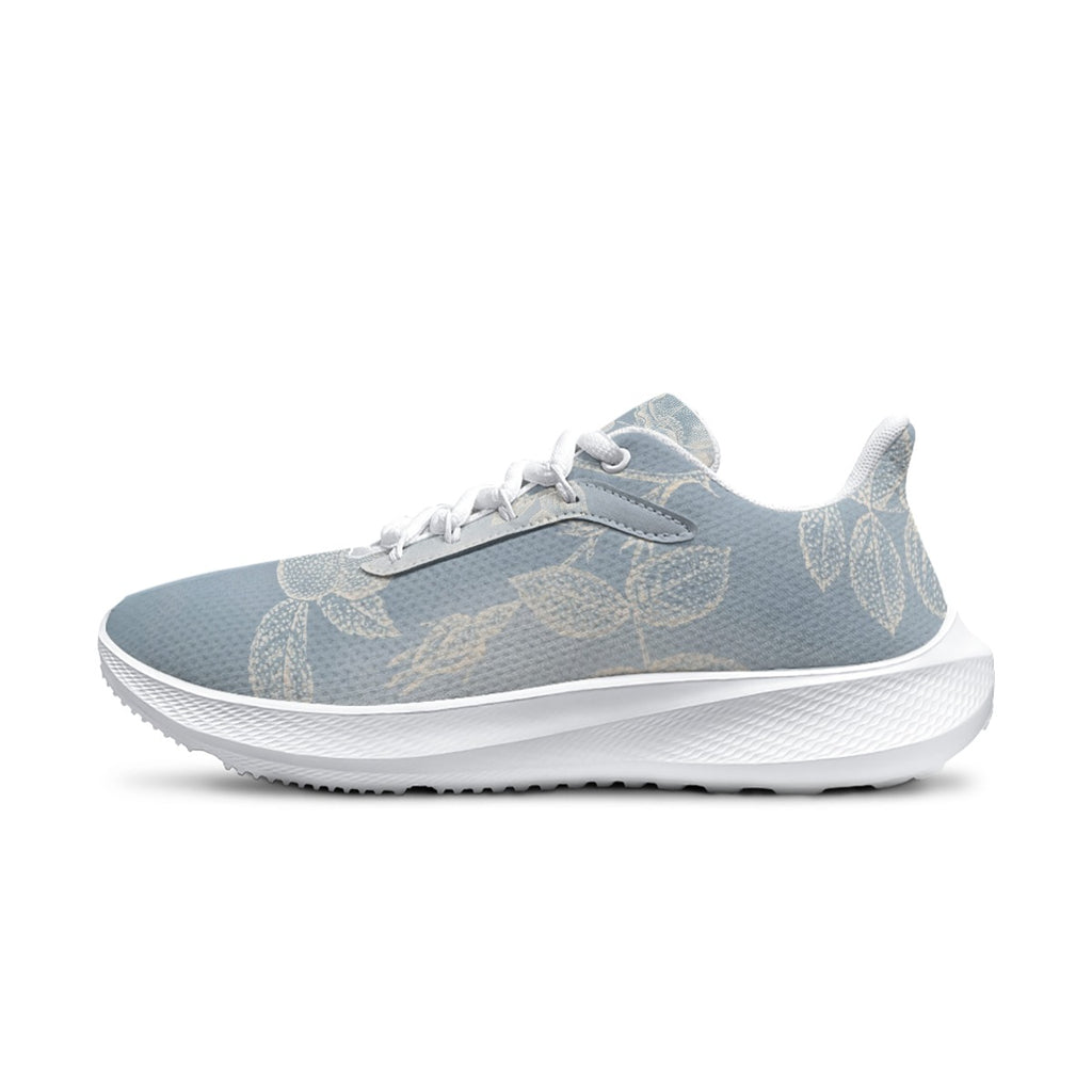Scarpa da running da donna azzurra con motivo floreale e dettagli grigi, suola bianca