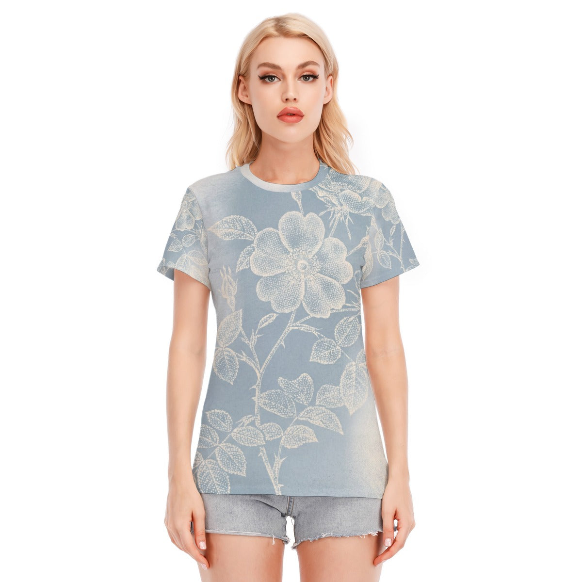 Maglietta donna azzurra con stampa floreale grande, scollo rotondo e maniche corte.
