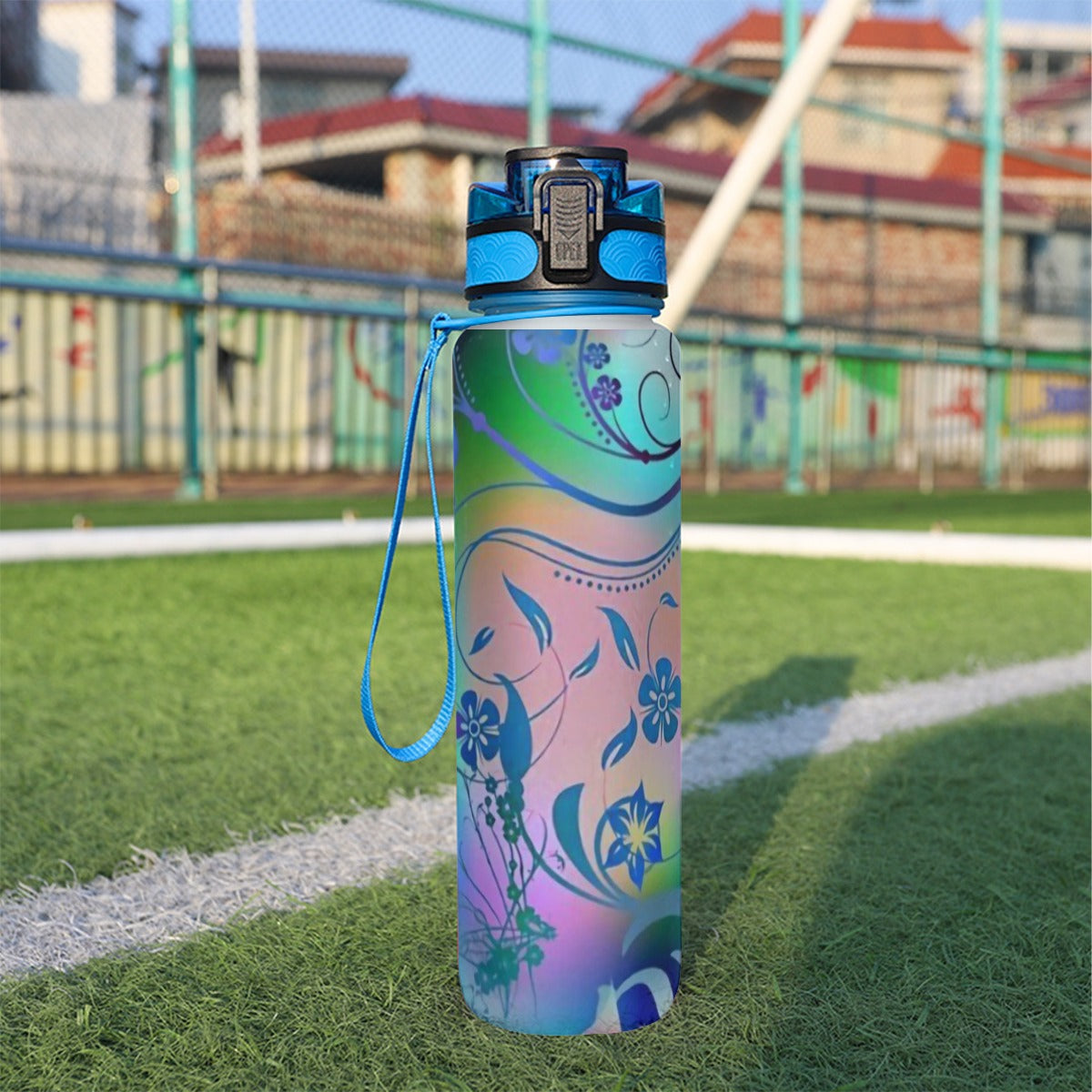 32 oz spor su şişesi, mavi kapaklı, pastel çiçek desenli renk geçişli matara